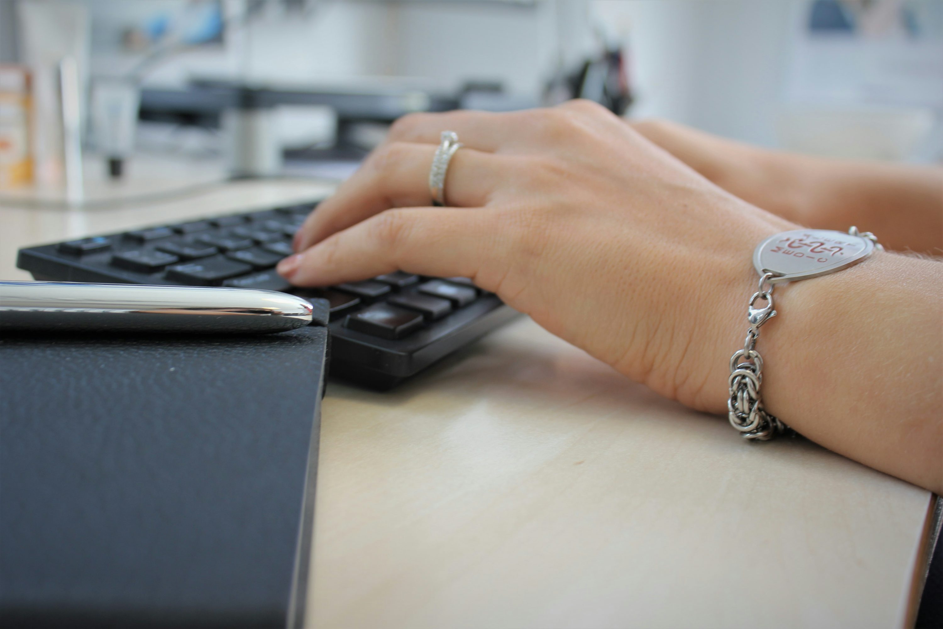 Professional using ergonomic split keyboard and vertical mouse for RSI prevention